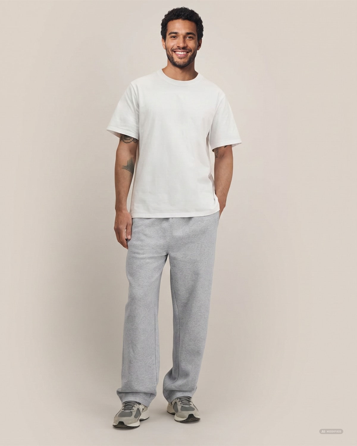 Straight Leg Unisex Jogginghose aus Bio-Baumwolle in Heather Grey – Vorderansicht am Model